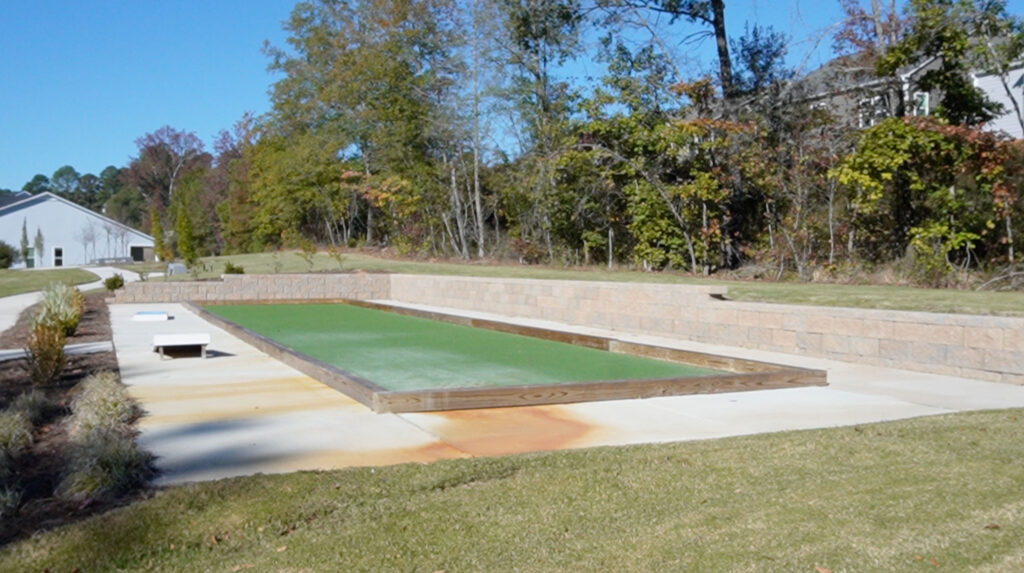 Ammenities at the Retreat at Cedar Crossing in Apex, NC include a fire pit, pickleball courts, a gazebo, and this bocce ball court.